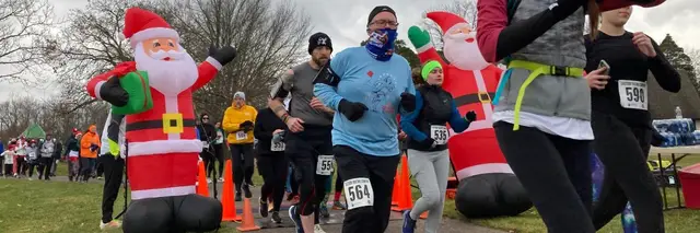 B.A.D SANTA TRAIL 5K logo