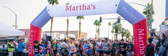 Martha's Village & Kitchen 20th Annual Thanksgiving Day 5K logo
