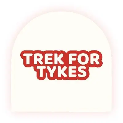 Trek for Tykes Walk thru Carmela's Magical Santa Land logo