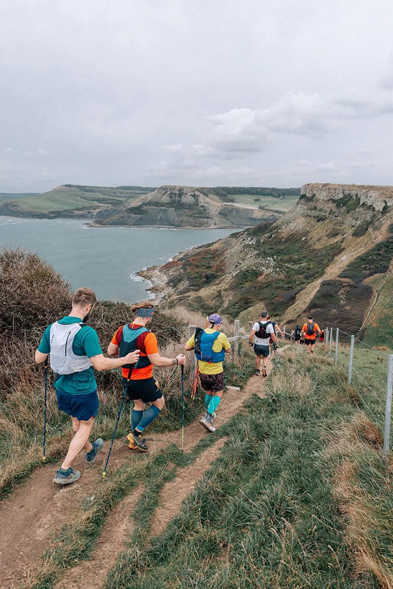 The Flora Maverick Jurassic Coast Hike 2026 Logo